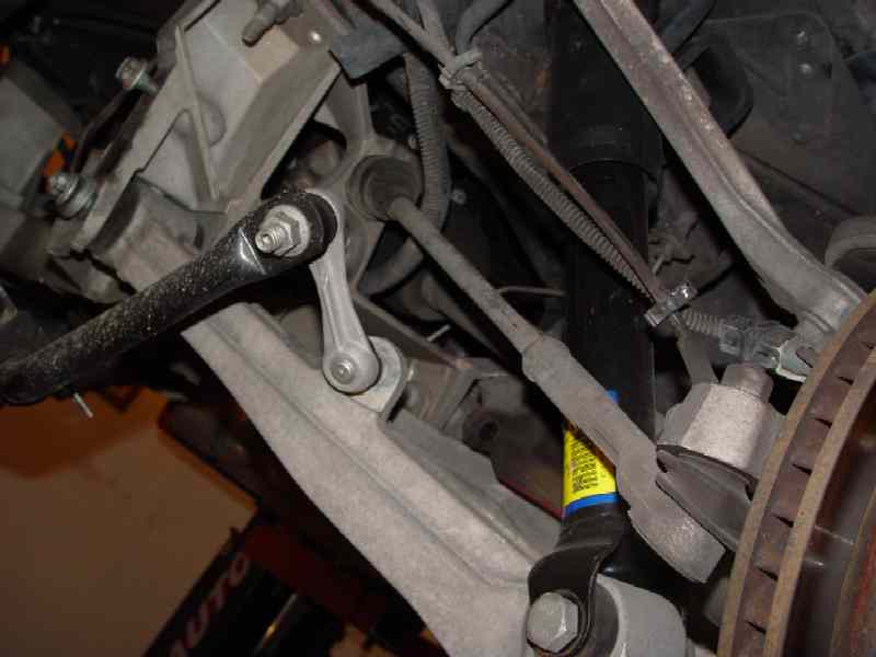 Fig. 1 Sway bar mounts removed and sway bar swiveled down.