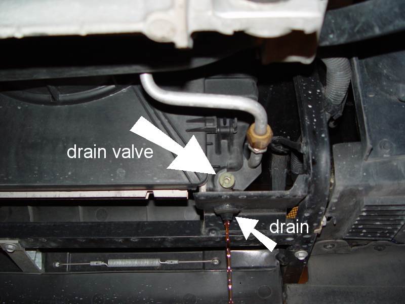 Fig.3 Draining the coolant. You can see the drain valve and the drain cock here. 