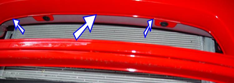 Arrows showinh lip to locate grille for marking holes.